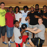 Students posing at bowling alley